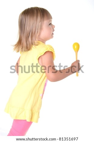 baby girl with rattle