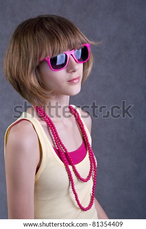 Teenage girl with sunglasses, studio shot