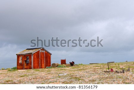 an old rusty metal shack on deserted wasteland