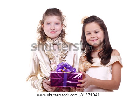 closeup image of the smiling little girls holding a gift box