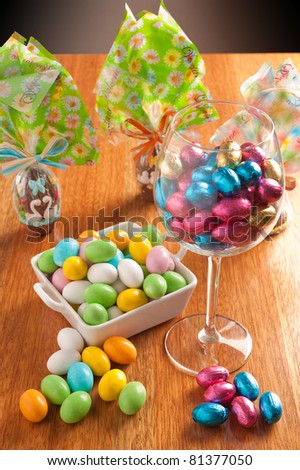easter eggs on a wooden table with some decoration element