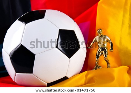 figure of football player football closeup and german flag