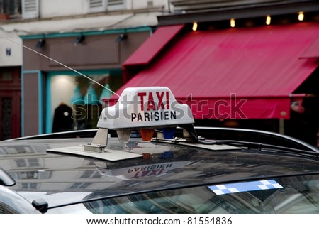 Parisian taxi, with the Cafe in the background.
