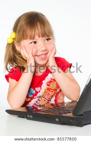 happy kid with a laptop on a white