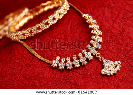 Gold ornaments on textured background.