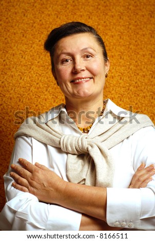 Elegantly stylish older woman in a classy, conservative outfit