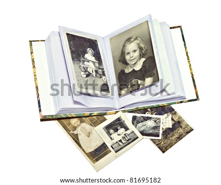 A photo album with old pictures of family members.