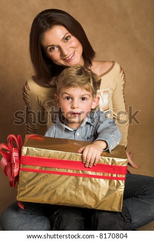 Woman and boy checking christmas presents