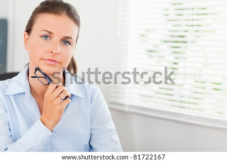 Serious businesswoman posing in her office