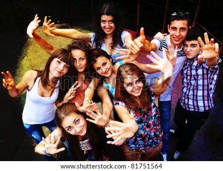 A group of young people dancing at a disco. Royalty-Free Stock Photo #81751564
