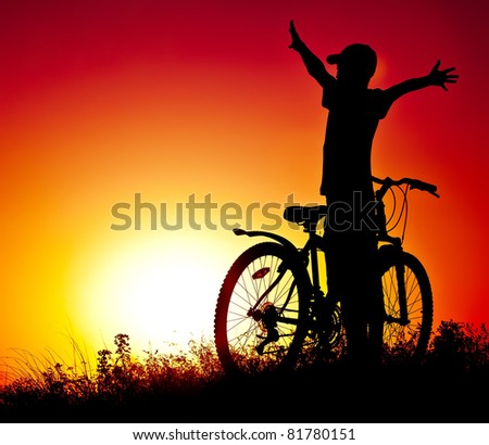 The boy on a bicycle against a decline
