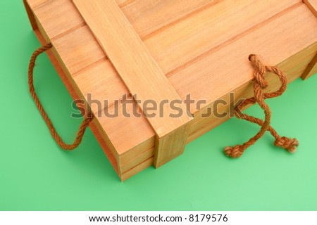 white wooden box on green background