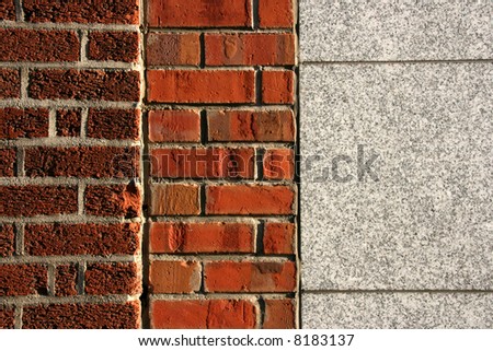 Connection of three walls: two types of brick wall and a granite one