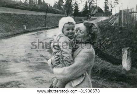 Vintage photo of mother and baby (fifties)