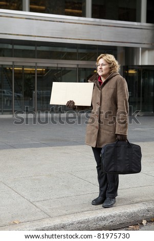 Outdoor business woman with blank sign vertical
