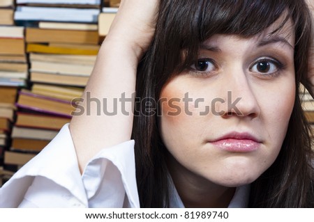 Young student girl with worried expression on her face