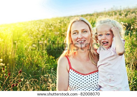 Happy mother and daugther in sunny day