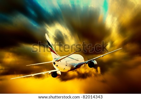 Silhouette of airplane on sunset sky
