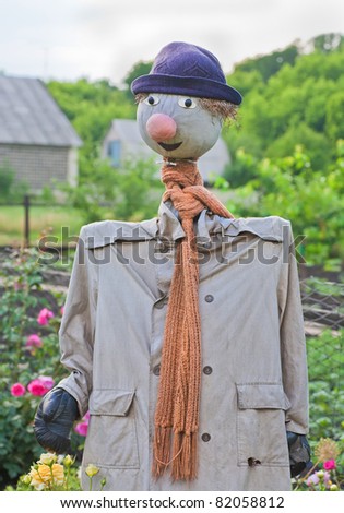 photo of scarecrow in field on a sunny day