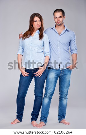 Young fashion expressing couple in jeans