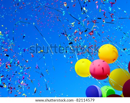 multicolored balloons and confetti in the city festival