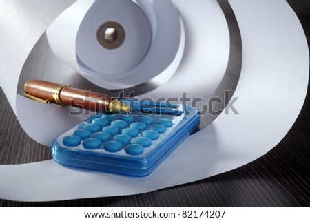 stock image of the rolled of paper and calculator