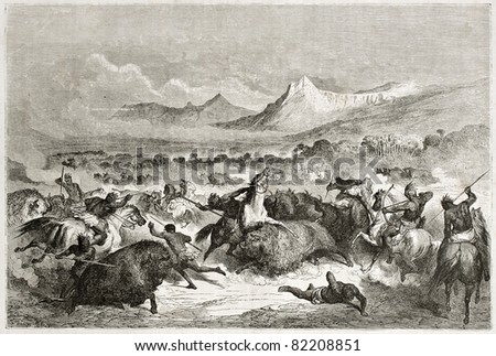 Old illustration of native Americans hunting buffalo. Created by Dore after Caitlin, published on Le Tour du Monde, Paris, 1860