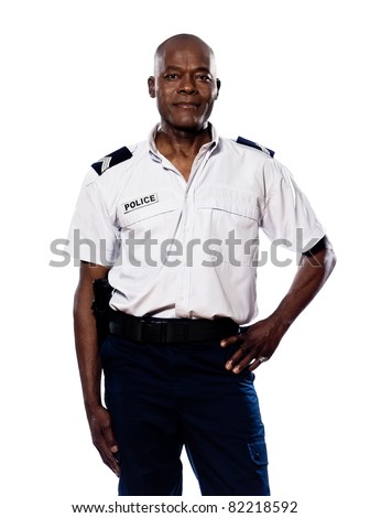 Portrait of a smart afro American policeman smiling with hand on waist in studio on white isolated background