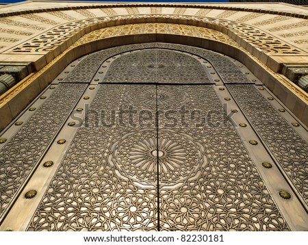 Casablanca, Morocco:  Detail of ornate exterior of brass door of Hassan II Mosque Royalty-Free Stock Photo #82230181