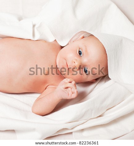 Picture of the newborn resting on a bed