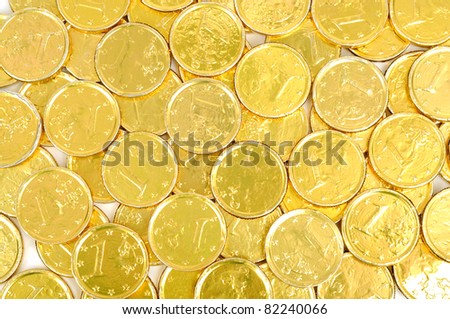 Gold coins of one euro background, isolated on white
