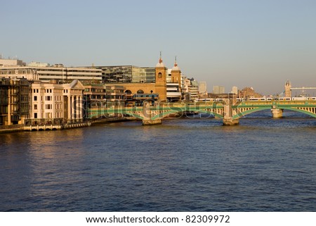 London view, river thames with some old and new buildings