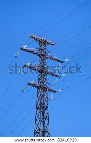 Electric High Voltage Pylon on Blue Sky Background