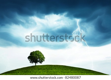 Landscape with storm and tree Royalty-Free Stock Photo #82480087