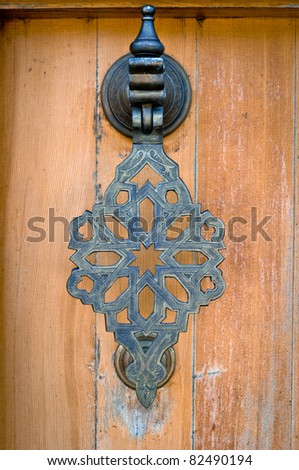 The door handle in the Oriental style. Toning. Vignetting.