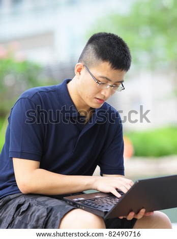 man using notebook computer