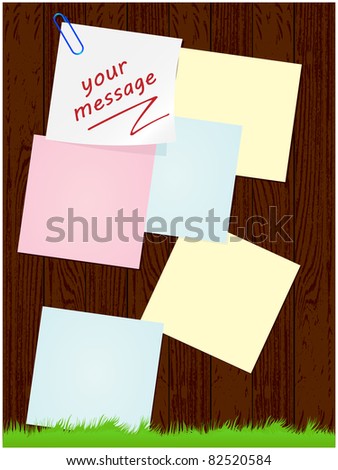 Wooden background with green grass and leaves to paper records
