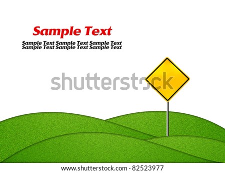 Empty yellow warning road sign with green grass isolated on white