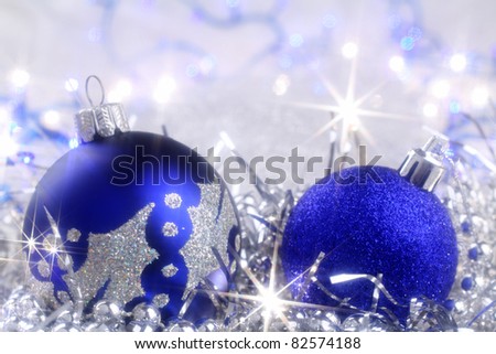 Silver Christmas card with blue ornaments and sparkling Christmas lights