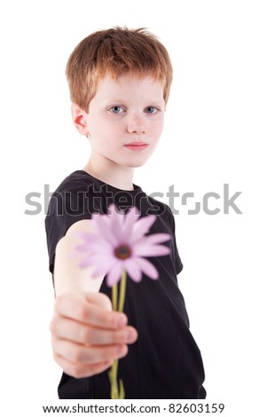 cute boy offering flowers,  isolated on white background. Studio shot