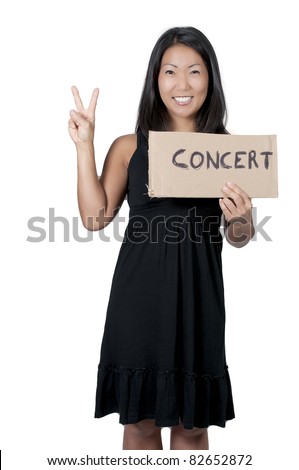 A beautiful Asian woman with a sign hitch hiking to a concert