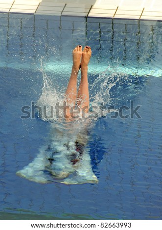 Swimmer launched into water in a diving competition