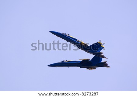 Here is a photo of two jet fighters performing a maneuver while flying at over 400 mph