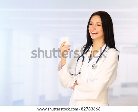 Young latin doctor having a break and drinking coffee