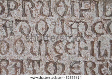 Beautiful old writing carved into stone
