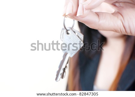 Business hand putting key isolated on the white background.
