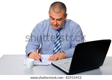 Man businessman blue shirt tie work is concentrated at the table laptop isolated on a white background