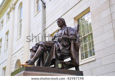 John Harvard statue in front of University Hall in Old Harvard Yard, Harvard University, Cambridge, Massachusetts MA, USA. Royalty-Free Stock Photo #82987198