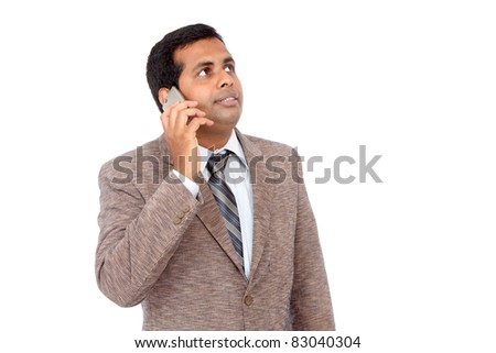 Indian businessman talking in mobile phone.