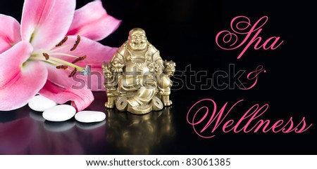 buddha with stones and lily flower. spa and wellness concept